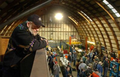 Herman Lackyard watches buyers mill around in his shop during an auction to sell off the assets of his business, Herman Automotive, in Coeur d'Alene Saturday.
(Jesse Tinsley / The Spokesman-Review)