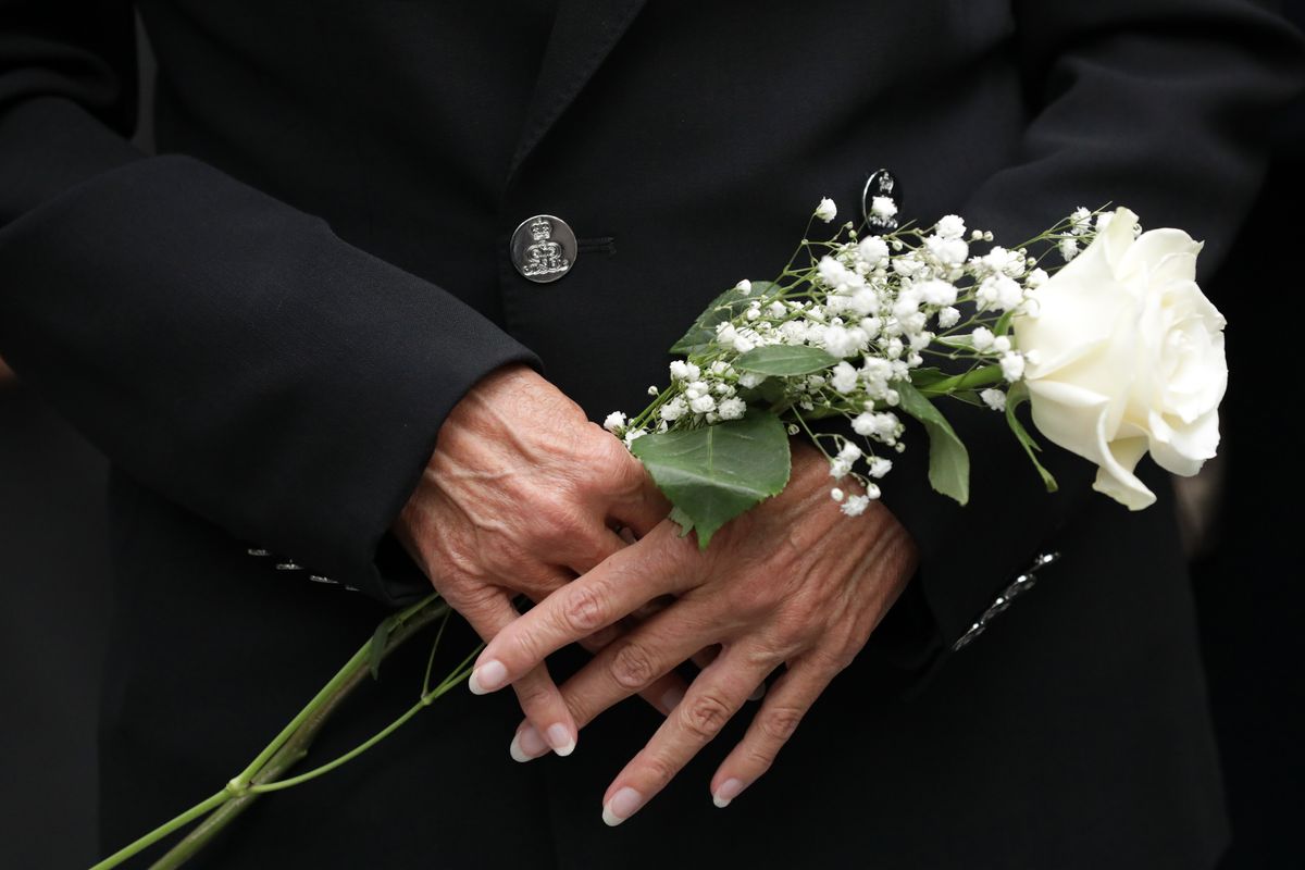 Jill Biden holds flowers as she attends the 19th anniversary ceremony in observance of the Sept. 11 terrorist attacks at the National September 11 Memorial & Museum in New York, on Friday, Sept. 11, 2020.  (Amr Alfiky)