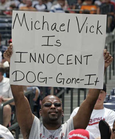 
Eris Banks of Conyers, Ga., shows his support for Atlanta Falcons quarterback Michael Vick during a baseball game between the Atlanta Braves and Cincincinnati Reds on Wednesday. Associated Press
 (Associated Press / The Spokesman-Review)