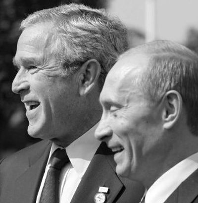 
President Bush and Russian President Vladimir Putin meet Thursday during a break in the Group of Eight summit. 
 (Associated Press / The Spokesman-Review)