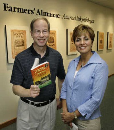 
Editor Peter Geiger and managing editor Sandi Duncan display a copy of 2008 Farmers' Almanac last Friday.Associated Press
 (Associated Press / The Spokesman-Review)