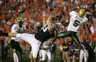 
South Florida's Nate Allen picks off a pass in the end zone intended for Auburn's Tommy Trott. Associated Press
 (Associated Press / The Spokesman-Review)