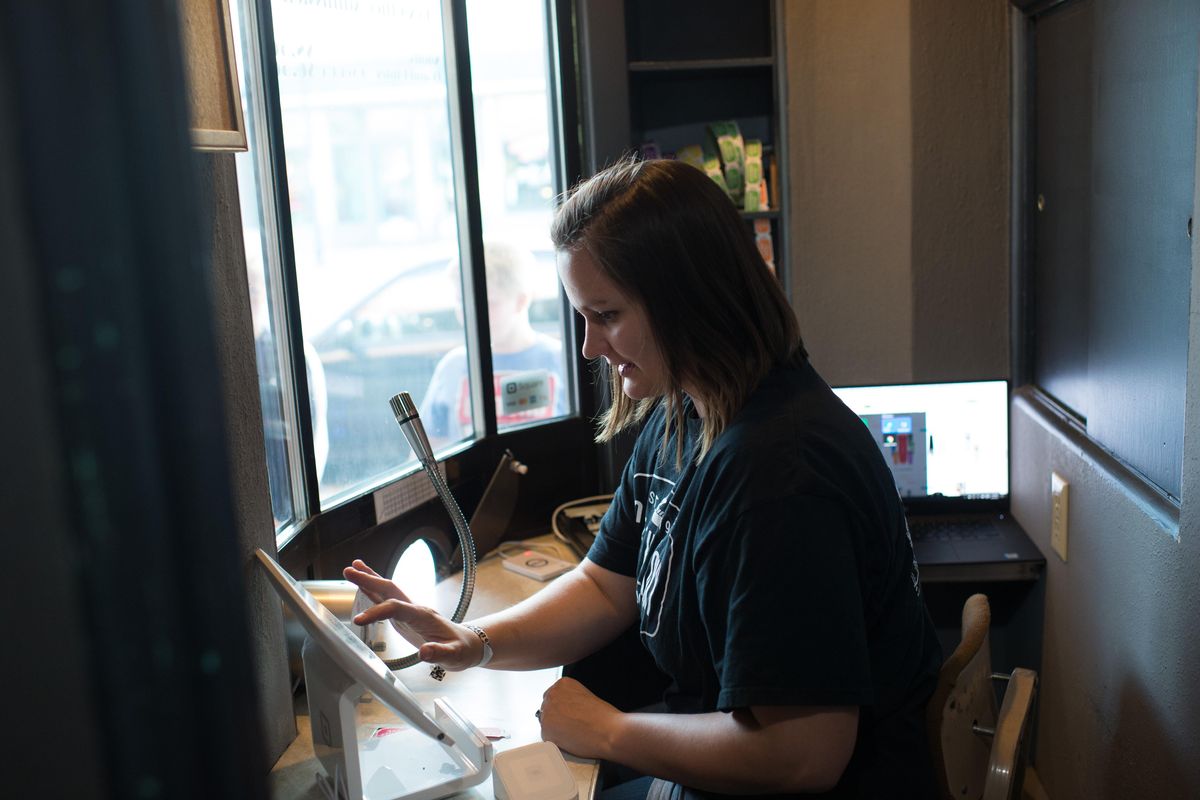 Brittany Totland sells tickets at the Roxy on Wednesday, Aug. 16, 2017, in Newport, Wash. (Tyler Tjomsland / The Spokesman-Review)