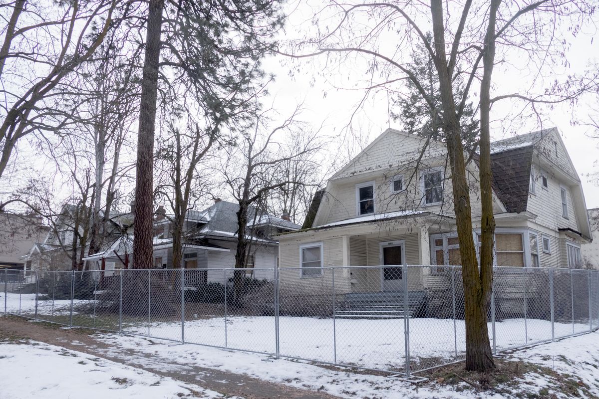 These three older homes will be demolished to make way for nine apartment units at the corner of 9th Avenue and Madison Street, shown Thursday, Dec. 21, 2017. (Jesse Tinsley / The Spokesman-Review)