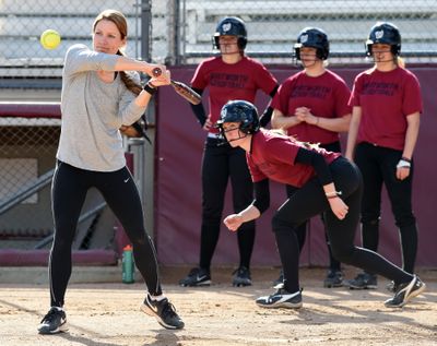 Whitworth softball coach Cristal Brown puts her players through situation drills during practice earlier this week. (Colin Mulvany)