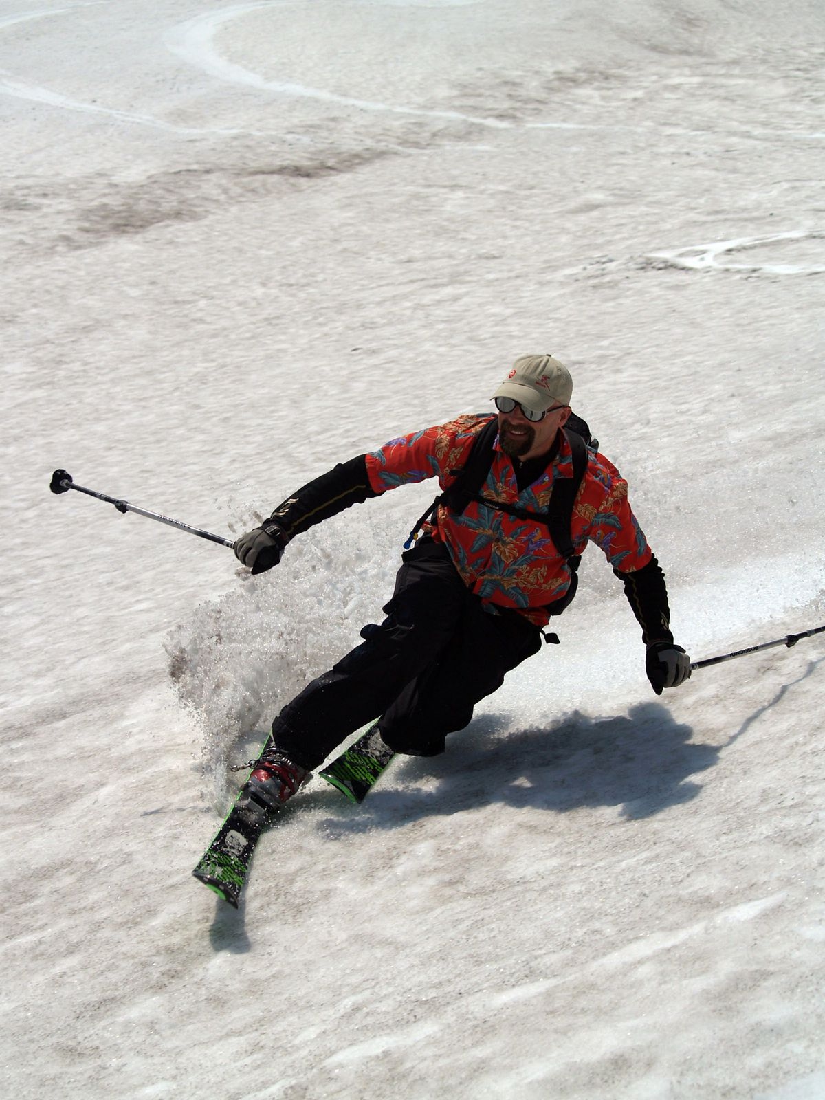 Scott Evans of Kellogg lays down telemark turns in soft spring corn snow July 1 after climbing to 8,365 feet and the crater rim of Mount St. Helens. (The Spokesman-Review)