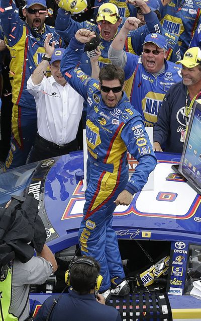 Martin Truex Jr. celebrates after winning the Sprint Cup race in Sonoma, Calif., on Sunday. (Associated Press)