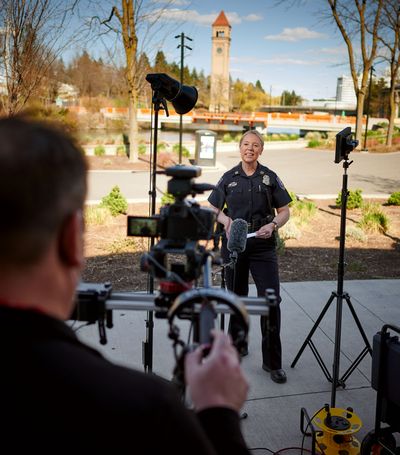 Spokane police Capt. Tracie Meidl films a police recruitment video in Riverfront Park on April 15.  (COLIN MULVANY/THE SPOKESMAN-REVIEW)
