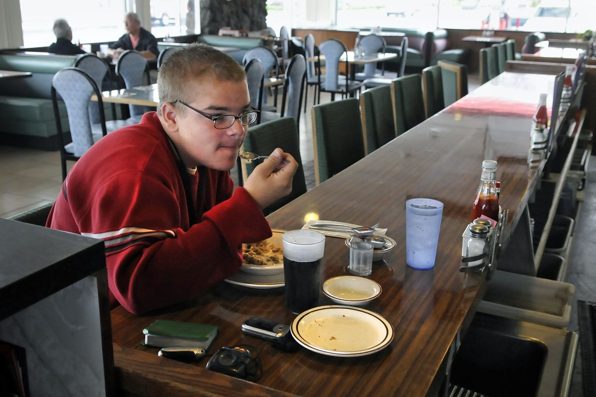 Andrew Wattles, 18, eats a bowl of oatmeal at Jenny