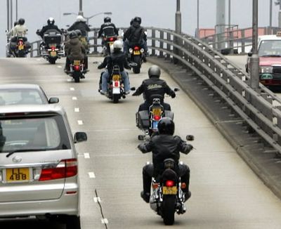 Riders on Harley-Davidson ride in commuter traffic, in this AP file photo.