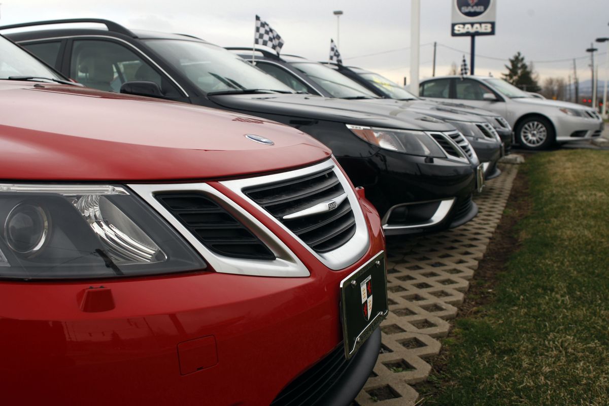 Sedans sit at a Saab dealership in Boulder, Colo., in March 2008.