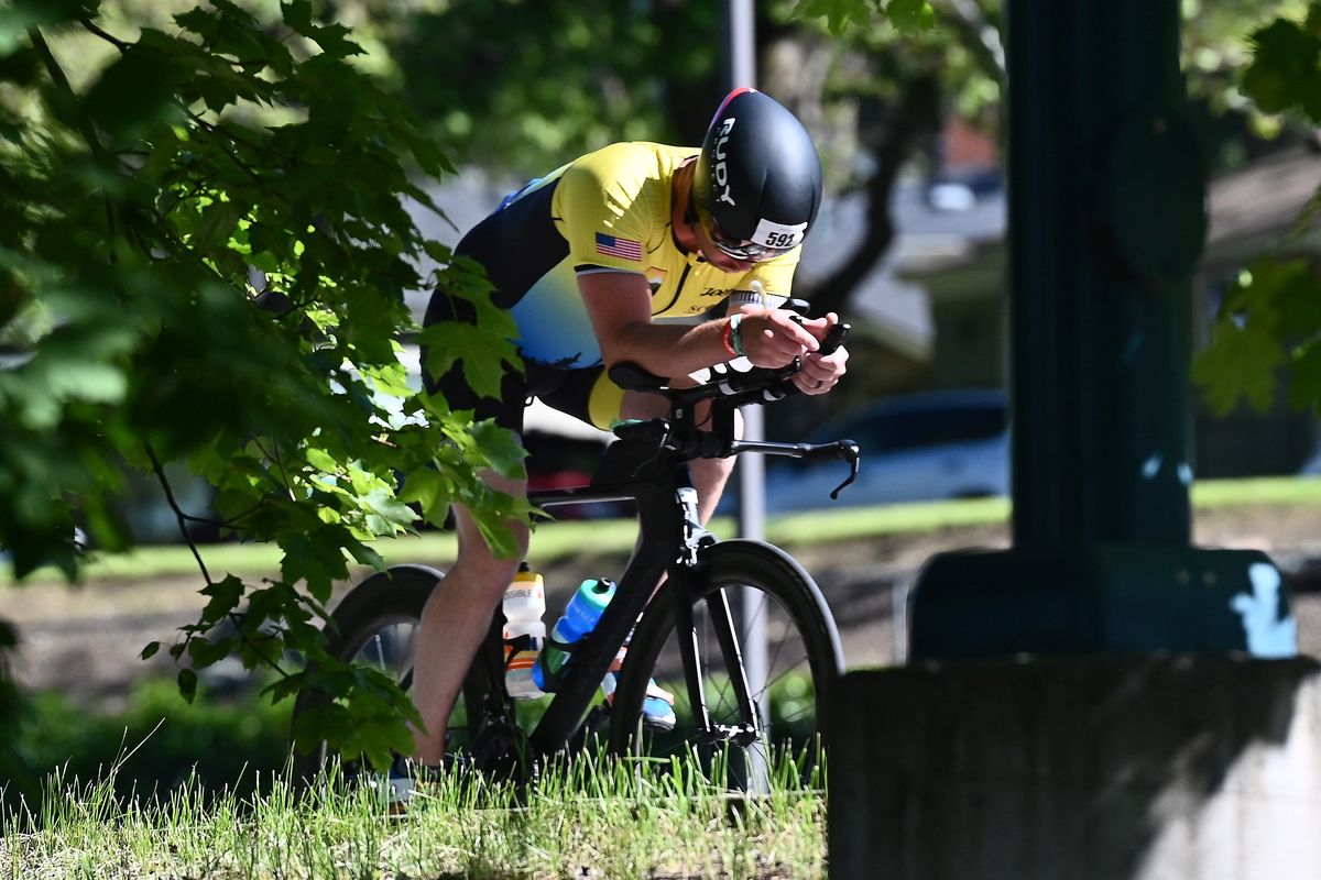A Ironman participant speeds by during the bicycle portion of the Coeur d’Alene Ironman on Sunday June 26, 2022 in Coeur d’ Alene ID.  (James Snook/For The Spokesman-Review)