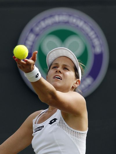 Jana Cepelova of Slovakia defeated Garbine Muguruza of Spain during their women's singles match on day four of Wimbledon. (Ben Curtis / Associated Press)