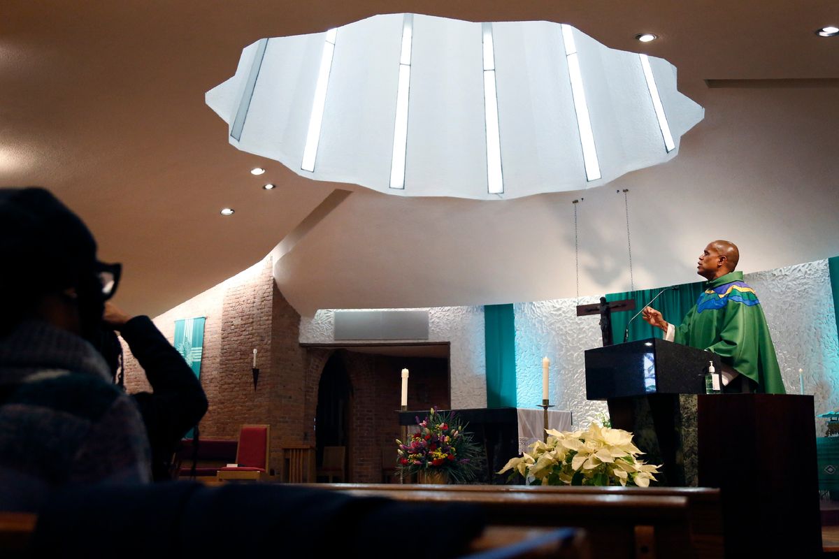 The Rev. Bryan Massingale gives a sermon on Sunday, Jan. 30, 2022, at St. Charles Borromeo Catholic Church in the Harlem neighborhood of New York. Massingale has received recognition for his work on racial justice, he supports the ordination of women, making celibacy optional for Catholic clergy, and as a gay man, he vocally disagrees with the church