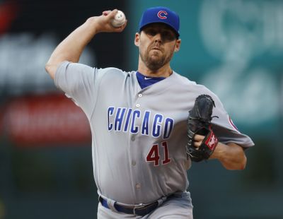 Chicago Cubs pitcher John Lackey struck out 10 in a win in the second game of a doubleheader with the Colorado Rockies in Denver. Colorado won the first game. (David Zalubowski / Associated Press)