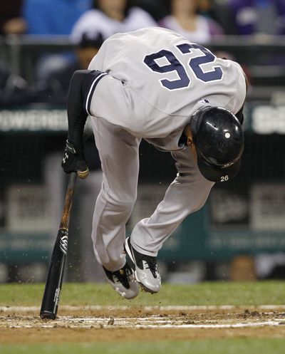 Yankees’ Eduardo Nunez leaps out of the way of a wild pitch that scored teammate Jesus Montero. (Associated Press)