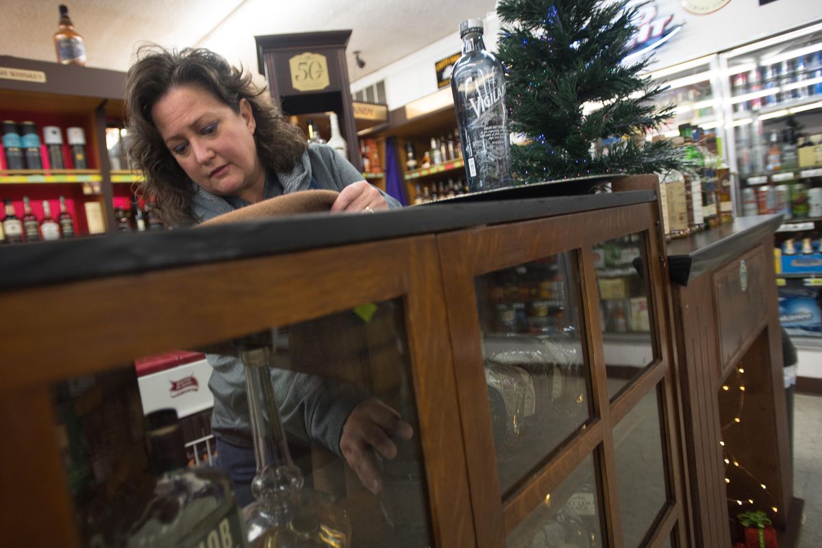 Manager Carolyn Seim restocks the shelves, Wednesday, Dec. 6, 2017, at Egger