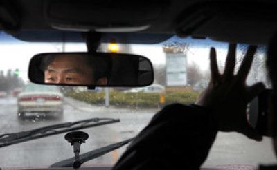 
Korean TV news producer Hyuk-Jin Noh and cameraman Kim Doo Sang follow Spokane COPS volunteers Wednesday while researching programs dealing with sex offenders who are released from prison. 
 (Holly Pickett / The Spokesman-Review)