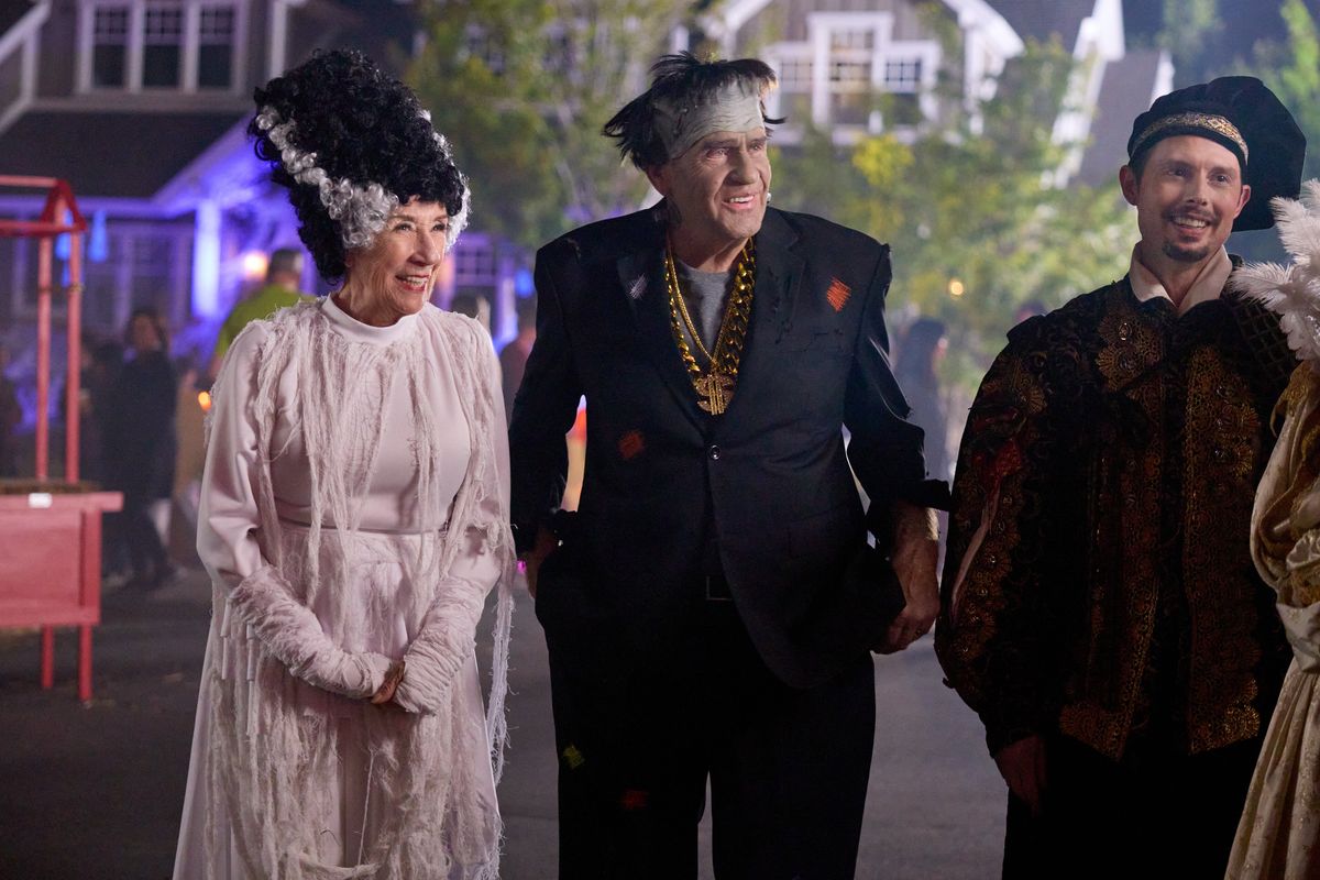 New, Halloween-obsessed neighbors inspire residents of Evergreen Lane, played by Ellen Travolta, left, Walter Platz and Daniel Kountz, to haul out their spookiest costumes and décor to become EverSCREAM Lane in Hallmark’s “Haul Out the Halloween.”  (Fred Hayes/Hallmark Media)