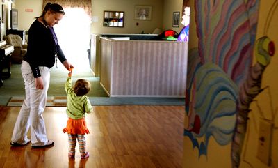 Kinderhaven direct care staff member Jennifer Doering with one of the children at the foster home in Sandpoint on  April 17.  (Kathy Plonka / The Spokesman-Review)