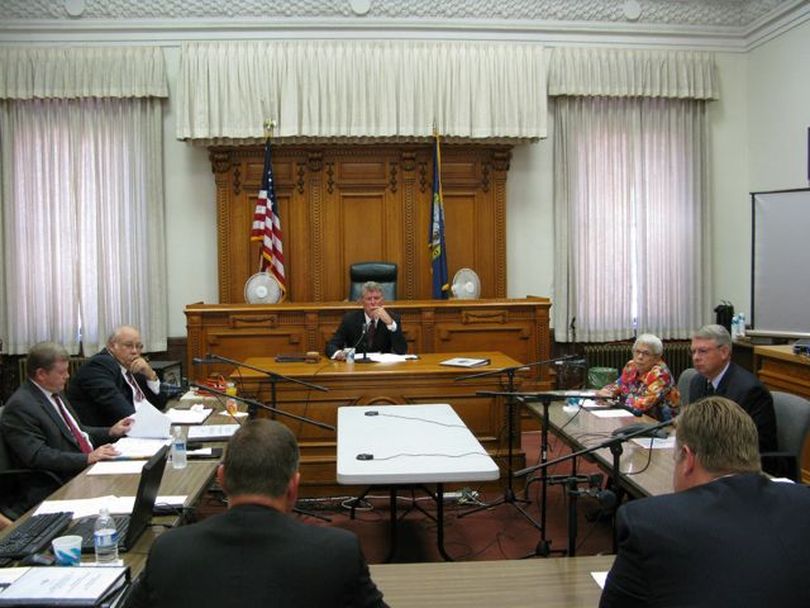 Idaho Gov. Butch Otter, center, presides over a meeting of Idaho's Constitutional Defense Council on Tuesday; at left are Idaho Attorney General Lawrence Wasden and Secretary of State Ben Ysursa, at right, state Controller Donna Jones and House Speaker Lawerence Denney. The council voted to pay more than $54,000 in attorney fees to an Arizona man who successfully challenged Idaho's presidential election laws, which have since been changed. (Betsy Russell)