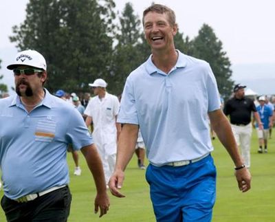 Former Sonics basketball great Detlef Schrempf, center walks with pro golfer Andres Gonzales during the Showcase Golf event. (Kathy Plonka)