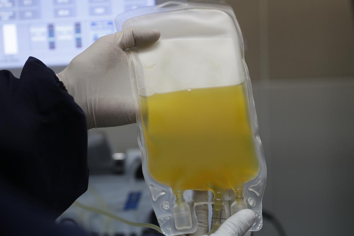 FILE - In this Friday, June 12, 2020 file photo, a doctor holds a bag of blood plasma donated by a COVID-19 survivor at at blood bank in La Paz, Bolivia. The U.S. Food and Drug Administration authorized the use of blood plasma for what