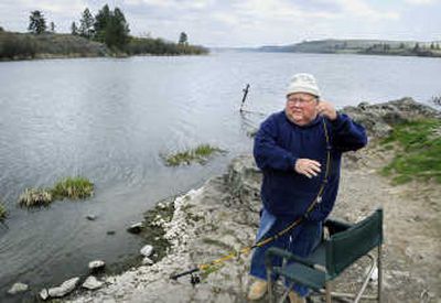 
Gary Clement, 66, of Spokane,  tries to land a few rainbow trout Wednesday at Rock Lake.  
 (Dan Pelle / The Spokesman-Review)