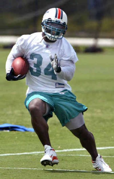 
Miami Dolphins running back Ricky Williams has taken part in the Miami Dolphins' training camp for the last time. Williams announced his retirement on Saturday. 
 (Associated Press / The Spokesman-Review)