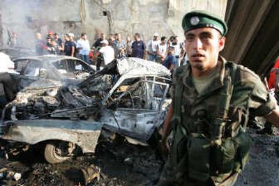
A Lebanese soldier stands in front of the site of a bombing  off the main waterfront in Manara, in the Muslim sector of Beirut, on Wednesday.  An anti-Syrian lawmaker and nine others were killed. Associated Press
 (Associated Press / The Spokesman-Review)
