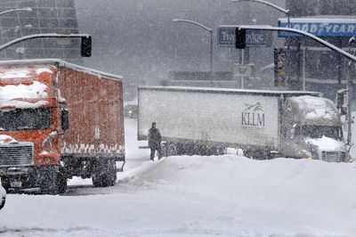A short but very slippery hill on Browne Street at Riverside Avenue caused several trucks to  get stuck  Monday.  (CHRISTOPHER ANDERSON / The Spokesman-Review)