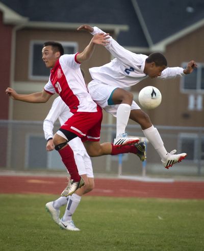 Connor Ourada of Ferris, left, and Noah Whitman of Central Valley compete for the ball in the first half. (Colin Mulvany)