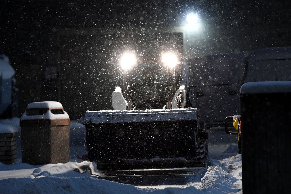 A plow clears sidewalks for commuters early Thursday at the Spokane County Courthouse in Spokane.  (Tyler Tjomsland/The Spokesman-Review)