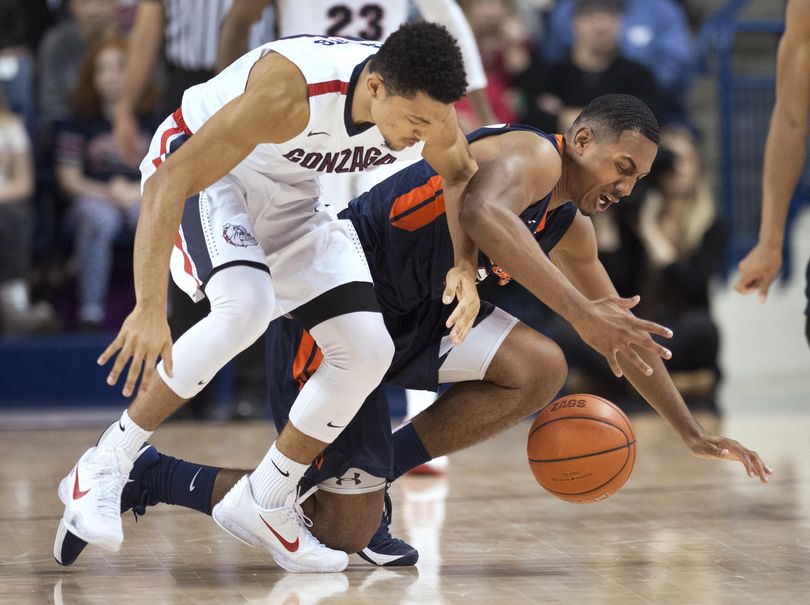 Gonzaga's Bryan Alberts tangles with Pepperdine's Lamond Murray for a loose ball in the second half, Monday, Dec. 21, 2015, in Spokane, Wash. (Dan Pelle / The Spokesman-Review)