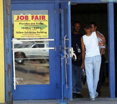 
Hurricane Katrina refugees Patrick Bryant, left, and his girlfriend Demetra Crayton, back to camera, attend a job fair as they look to relocate, at Arizona Veterans Memorial Coliseum on Thursday in Phoenix. 
 (Associated Press / The Spokesman-Review)