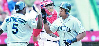 
Yuniesky Betancourt and Adrian Beltre celebrate Beltre's homer.
 (Associated Press / The Spokesman-Review)