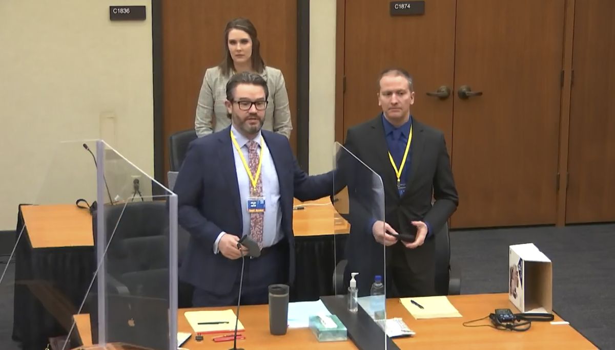 In this screen grab from video, defense attorney Eric Nelson, left, defendant and former Minneapolis police officer Derek Chauvin, right, and Nelson