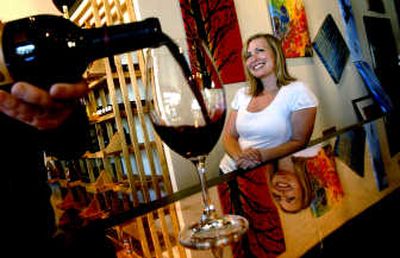 
Post Falls TimberRock Winery owner Michelle Rogers is pictured at the new tasting room in Coeur d'Alene. 
 (Kathy Plonka / The Spokesman-Review)
