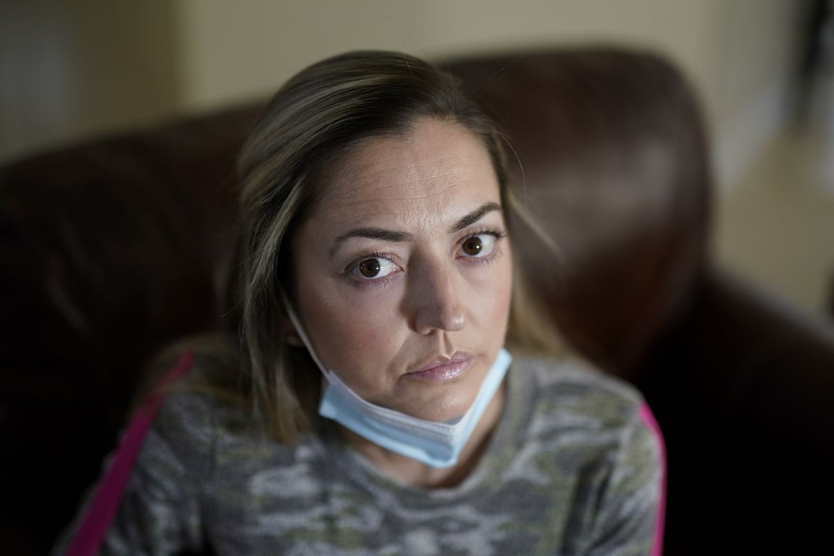 Maura Wozniak poses for a picture on Tuesday, Feb. 23, 2021, in Huntersville, N.C. Wozniak, a 42-year-old mother of 2 has cystic fibrosis and also has undergone lung transplants and has been moved into group 4, just ahead of the general public receive the COVID-19 vaccination. (Chris Carlson)