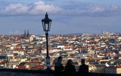 
Tourists view the panorama of Prague, Czech Republic, from Prague Castle. 
 (Associated Press / The Spokesman-Review)