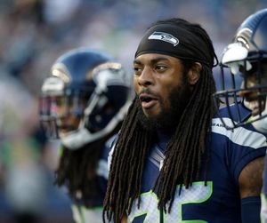 In this Aug. 18, 2016, file photo, Seattle Seahawks cornerback Richard Sherman stands on the sideline before a preseason NFL football game against the Minnesota Vikings in Seattle. Sherman was the center of attention at a Las Vegas craps table last week. (AP Photo/Elaine Thompson, File)
