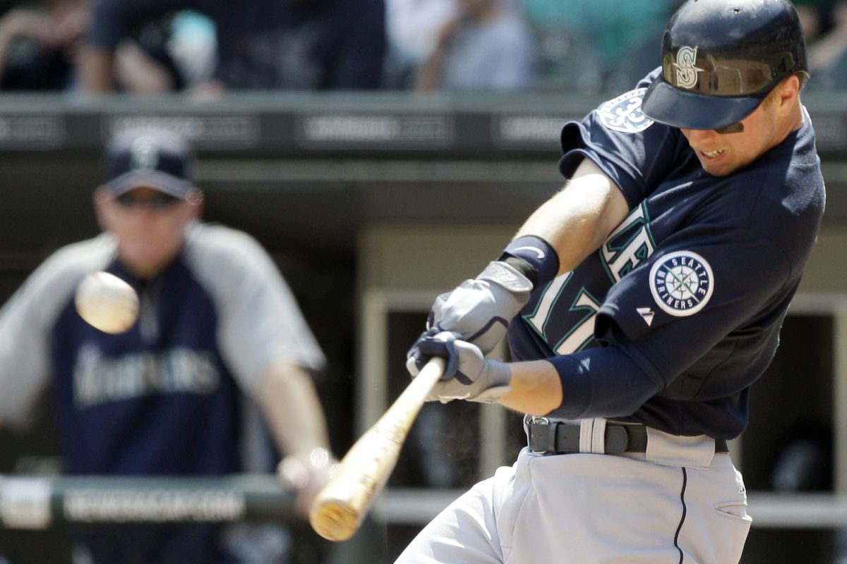 Justin Smoak of the Mariners hits a solo home run during the second inning. It was Smoak’s fifth homer in his past 10 games. (Associated Press)
