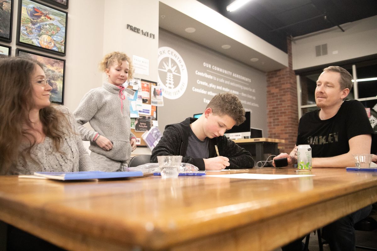 Danielle, Chloe, Remi and Jeff Dickman get their creative juices flowing during a Drop In and Draw session Jan. 29, 2020, at Spark Central in Kendall Yards.  (Libby Kamrowski/The Spokesman-Review)