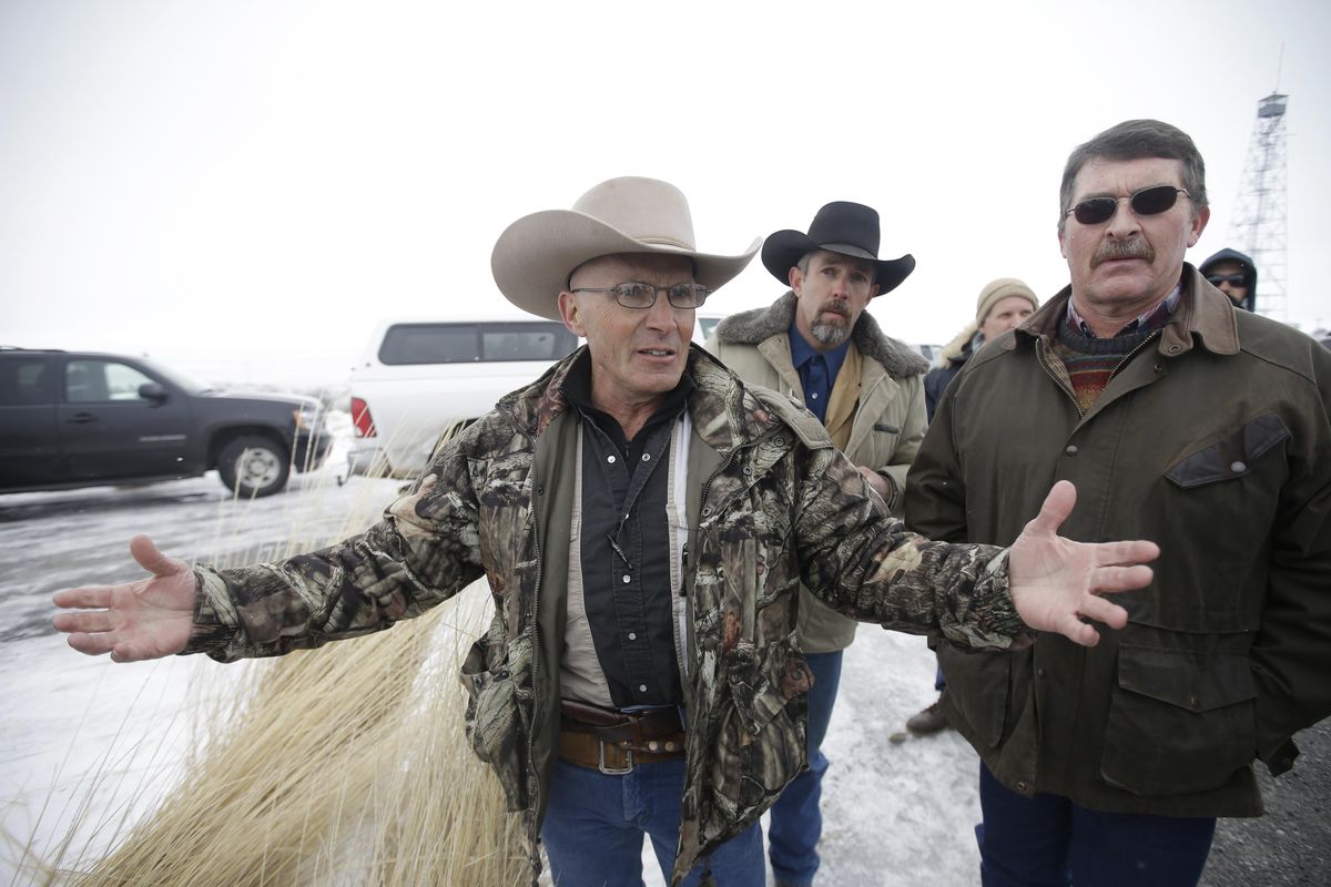 In this Jan. 9, 2016 file photo, Robert “LaVoy” Finicum, left, a rancher from Arizona, talks to reporters at the Malheur National Wildlife Refuge near Burns, Ore. The family of Finicum, an Arizona rancher fatally shot by Oregon State Police during the armed occupation of a national wildlife refuge, alleged in a federal lawsuit Friday, Jan. 26, 2018, that he was “deliberately executed by a preplanned government ambush.” (Rick Bowmer / File/Associated Press)