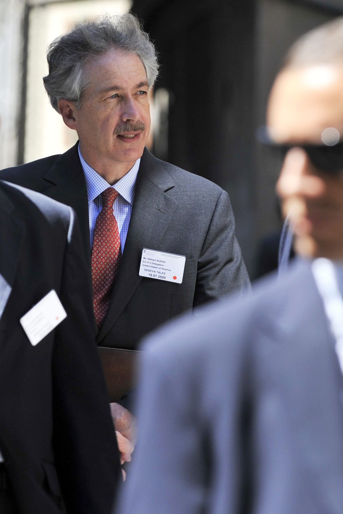 U.S. Undersecretary of State William J. Burns walks in the Old Town of Geneva during a meeting break. (Dominic Favre / The Spokesman-Review)