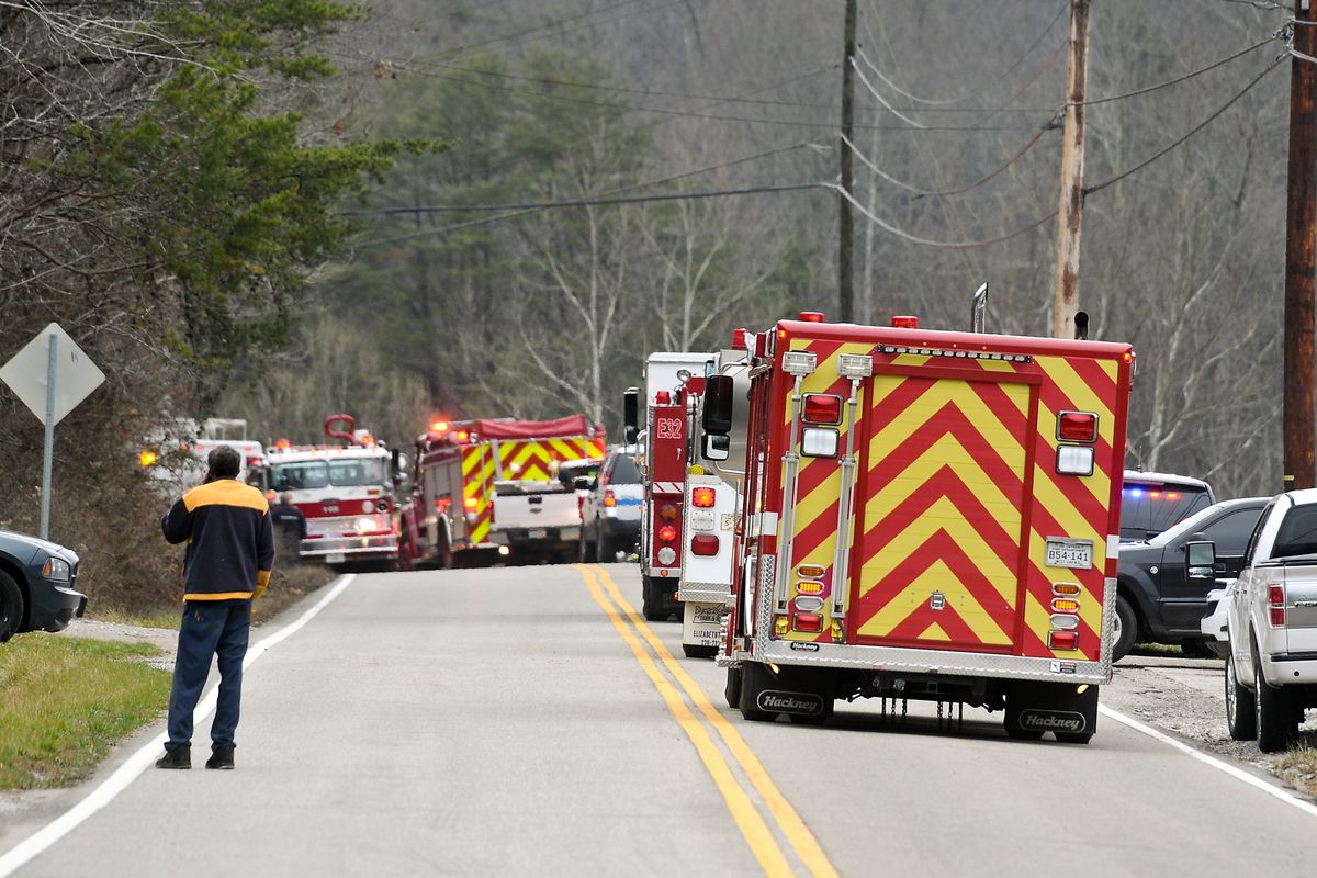 Emergency vehicles from every agency aailable line the roadway of Route 21 in between Sissonville, W.V., and Pocatalico, W.V., Tuesday Dec. 11, 2012, after a natural gas line explosion.   At least five homes went up in flames Tuesday afternoon and a badly burned section of the expressway in West Virginia was closed after a natural gas line exploded in an hour-long inferno. (Robert Wojcieszak / Charleston Daily Mail)