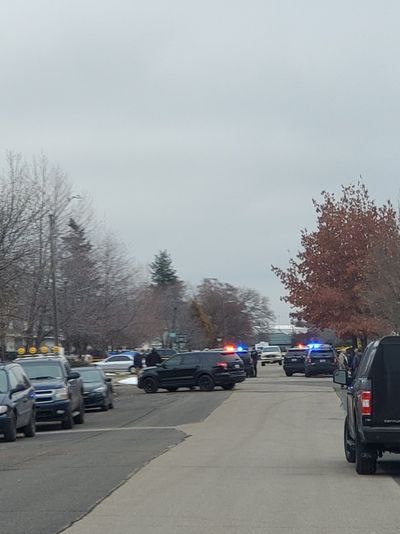 Spokane Police responded Monday afternoon to a man they say held a knife to an infant’s throat on the 2400 block of East Desmet Avenue. He was shot and killed by two officers, the police chief said.  (Sydney Brown / The Spokesman-Review)