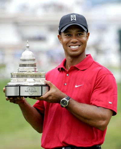 Tiger Woods poses after winning the AT&T National at Congressional Country Club. (Associated Press / The Spokesman-Review)