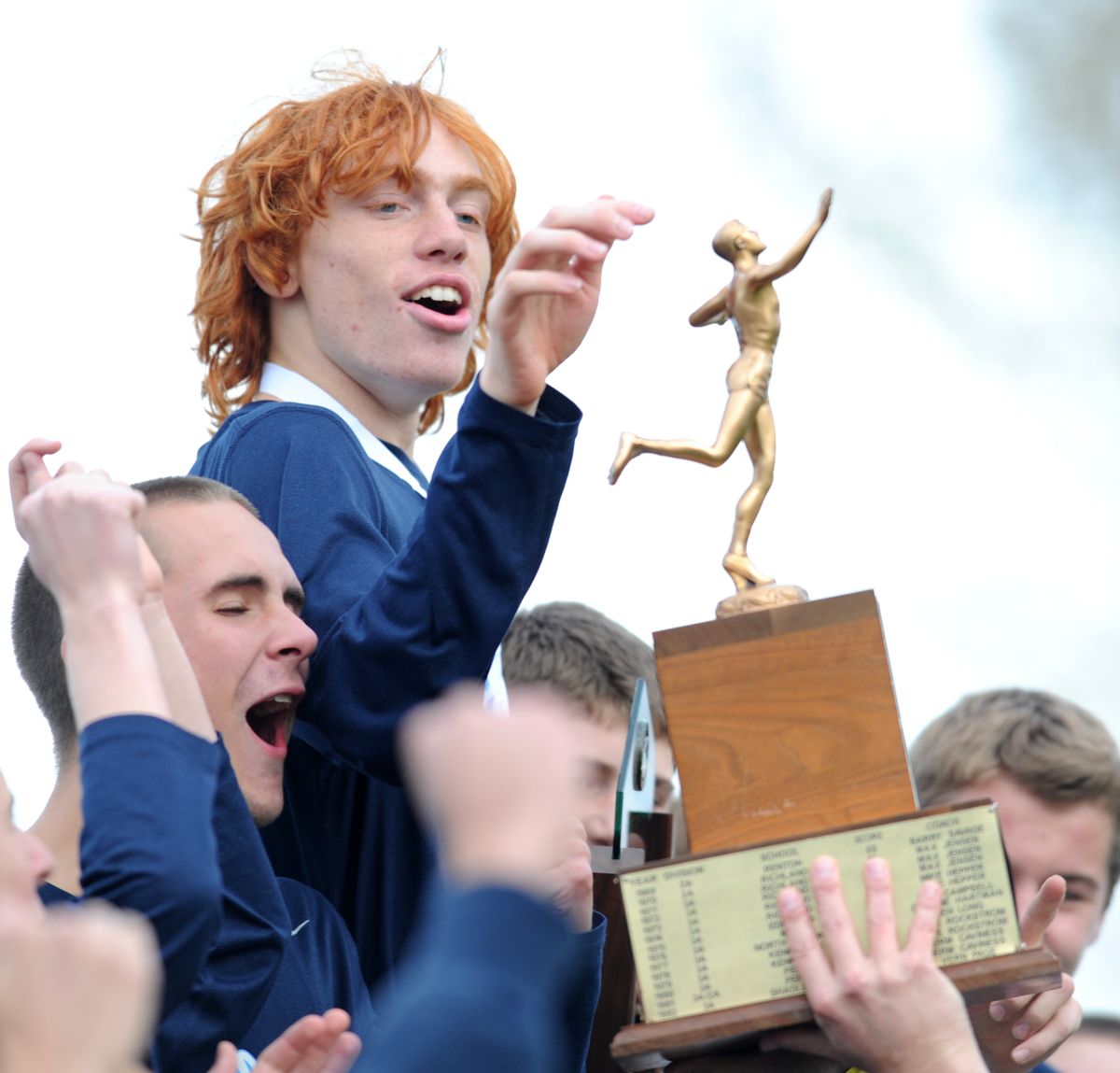 Central Valley’s Logan Giese, who placed 11th, admires the first-place state trophy. (Tyler Tjomsland)