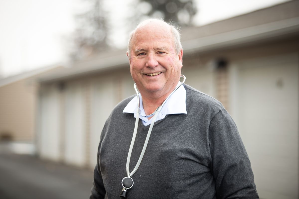 Longtime Spokane physician Bob Hustrulid, 78, plans to relocate his practice to Evergreen Fountains Senior Living Community in Spokane Valley. He is pictured here outside Evergreen on Monday. (Libby Kamrowski/ THE SPOKESMAN-REVIEW)